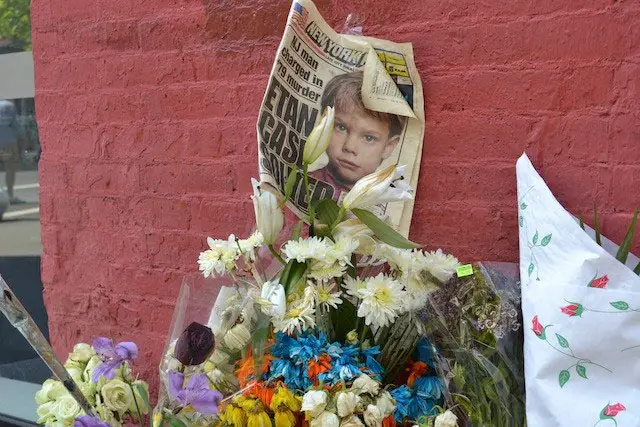 Photograph, taken in May, of flowers and other things left at the site where Patz was allegedly killed